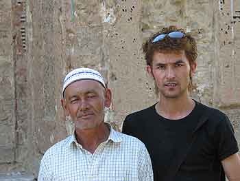 Photograph of interpreter and tomb custodian (left) of the Tughluq Tömur Khan <i>mazar</i> in Huocheng in 2004.