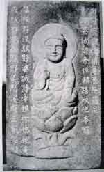 Fig. 31 Front of a four-sided pillar inscribed with Chinese Buddhist scriptures, with a seated Buddha figure carved in relief.