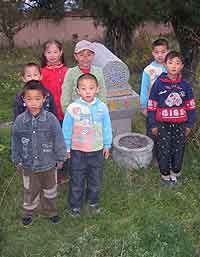 Fig. 2 Sixth-generation descendents of the shaykh of the Jahriyya sufi order and Muslim uprising leader Ma Hualong, in the garden of the Nanchuan Jahriyya tomb complex, Zhangjiachuan, Gansu. [AHG]